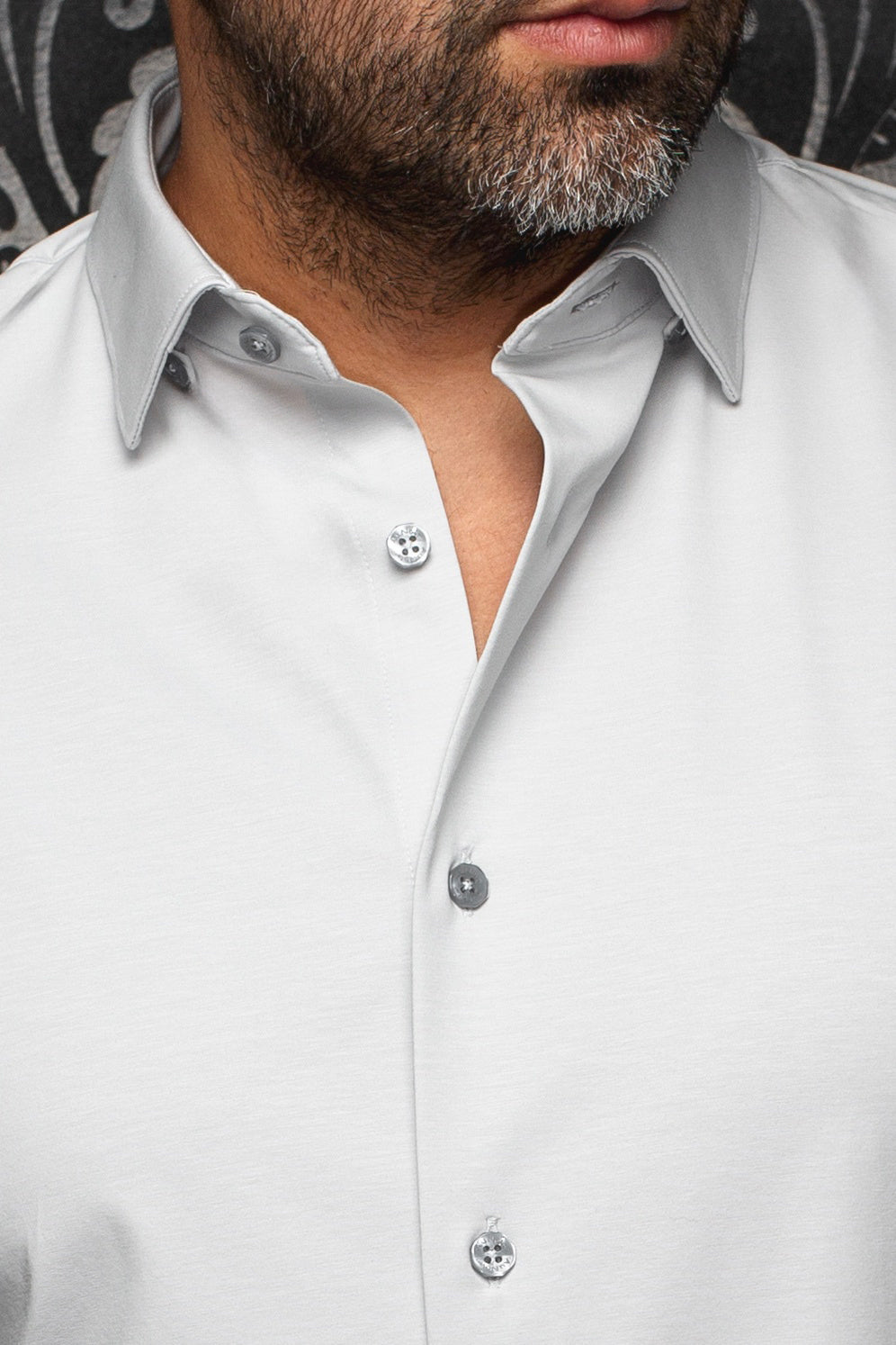 Au Noir men's light gray button-up shirt collar and placket with gray buttons and subtle texture, close-up
