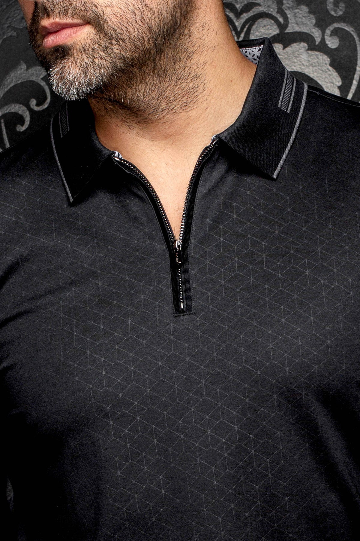 Au Noir men's black long sleeve polo with zipper placket, gray collar trim and tonal pattern, close-up