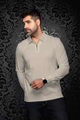 Au Noir men's beige long sleeve quarter-zip polo with striped collar trim, front model view