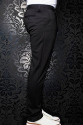 Au Noir men's black pants side view with belt loops, buttoned welt back pocket and tapered leg