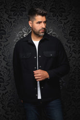 Men's black overshirt front view with snap closure and two flap chest pockets on model by Au Noir