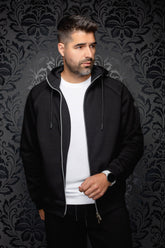 Au Noir men's black hooded zip sport jacket worn open, with silver zipper and long drawstrings, front model view