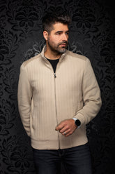 Men's beige zip bomber jacket on model, front view with stand collar, ribbed hem and herringbone texture by Au Noir