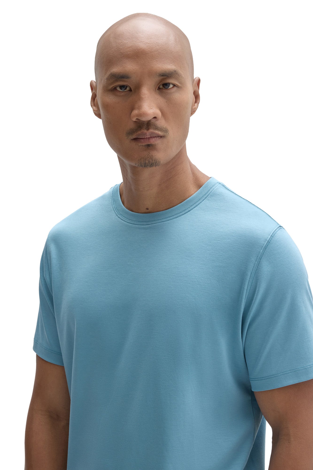 Close view of men's light blue crewneck Short-sleeve T-Shirt with shoulder and sleeve stitching by Robert Barakett