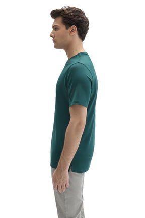 Side view of men's teal crewneck Short-sleeve T-Shirt showing the small side hem slit by Robert Barakett