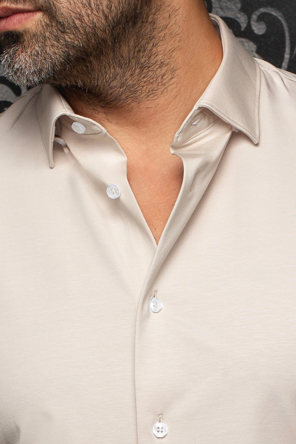 Au Noir men's light beige shirt collar and open button placket with white buttons, close-up