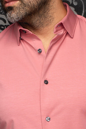 Close-up of men's pink shirt showing pointed collar, front placket and dark contrast buttons by Au Noir