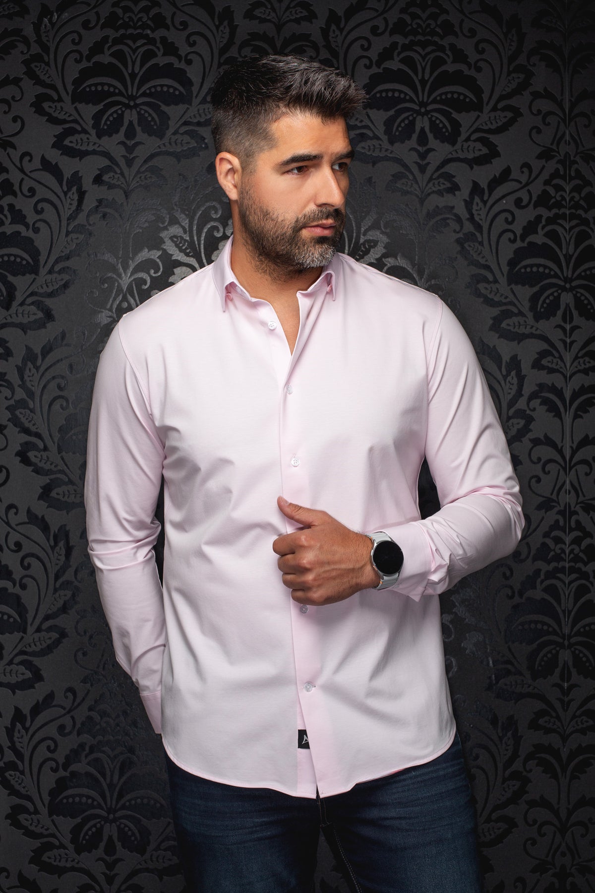 Au Noir men's light pink long sleeve button-up shirt front view with white buttons and curved hem on model