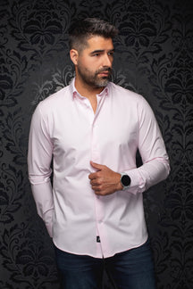 Au Noir men's light pink long sleeve button-up shirt front view with white buttons and curved hem on model