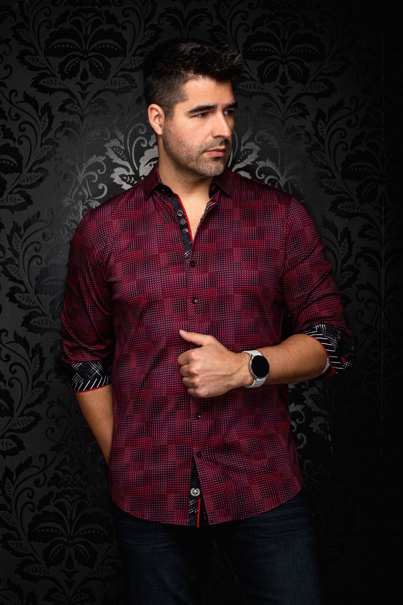 Au Noir men's front angled view of a red and black micro-check button-up shirt with rolled contrast cuffs, side view