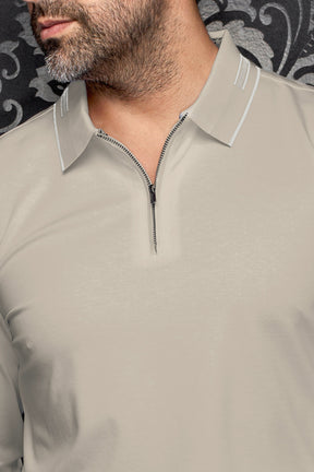 Au Noir men's beige long sleeve quarter-zip polo collar with white trim and subtle texture, close-up