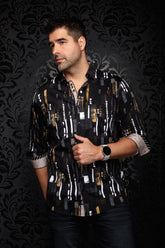 Au Noir men's black button-up shirt with white, gray, and gold abstract print and contrast cuffs shown from the front