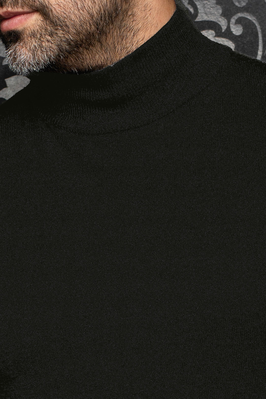 Au Noir men's black mock-neck knit merino sweater showing fine texture at the collar and shoulder, close-up