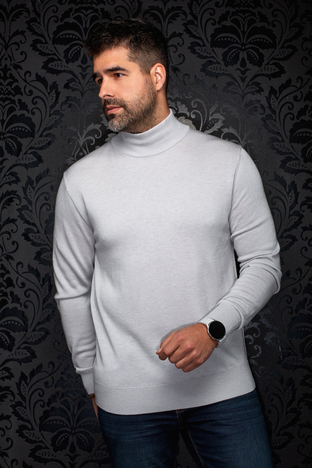 Men's light gray turtleneck knit merino sweater shown from the front with ribbed cuffs and hem by Au Noir