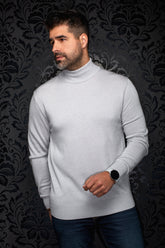 Men's light gray turtleneck knit merino sweater shown from the front with ribbed cuffs and hem by Au Noir
