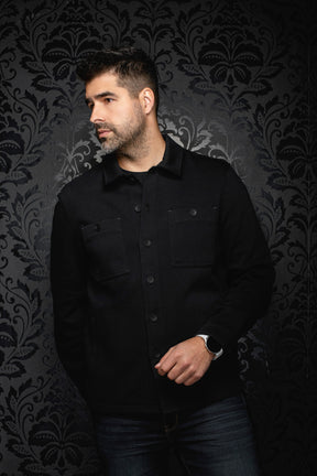 Men's black overshirt on model, angled front view with button placket and chest pockets by Au Noir
