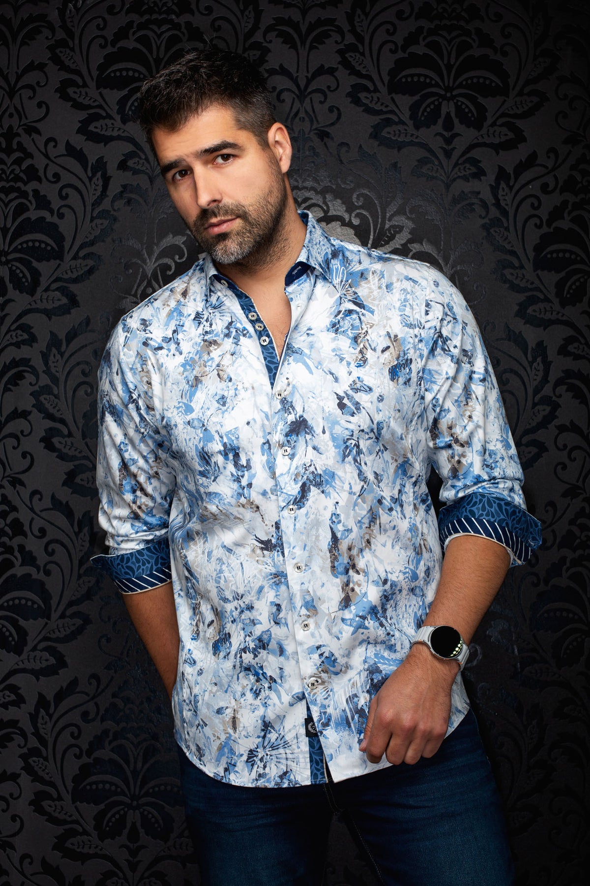 Front view of men's white printed button-up shirt with blue floral pattern and contrast rolled cuffs by Au Noir