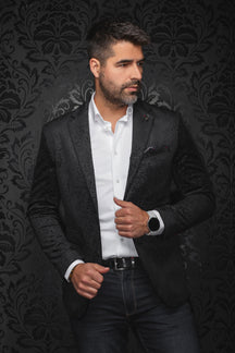 Au Noir men's black paisley jacquard blazer on model, front view with notched lapels and welt pockets