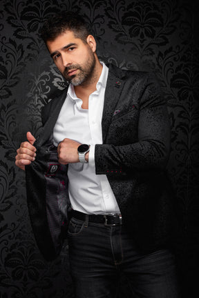 Au Noir men's black paisley jacquard blazer opened to show patterned lining, red accents, and cuff buttons, detail view
