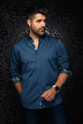 Front model view of men's blue patterned button-up shirt with contrast rolled cuffs and inner placket by Au Noir