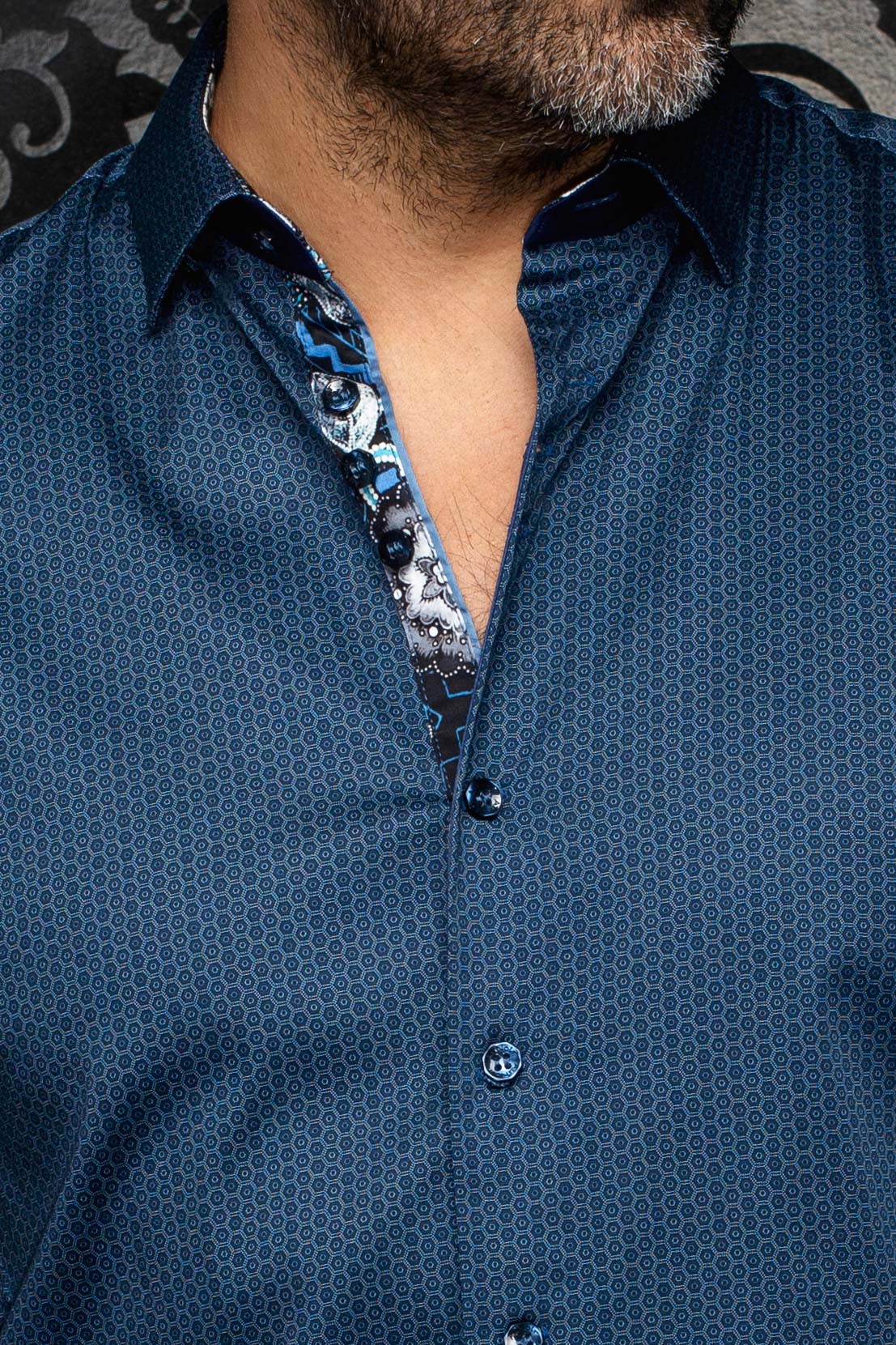 Au Noir men's blue patterned button-up shirt with spread collar and contrast floral inner placket, close-up