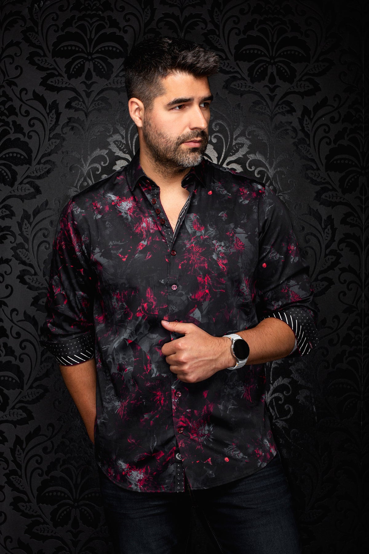 Men's black button-up shirt with red and gray floral print, front model view with rolled sleeves by Au Noir