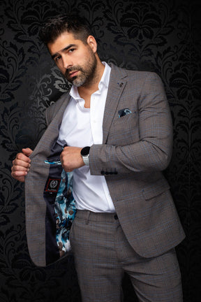 Men's gray-brown plaid blazer angled open, showing blue floral lining and inner label, detail view by Au Noir