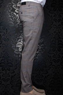 Au Noir men's brown plaid pants shown from the side, with buttoned back pocket and black waistband label