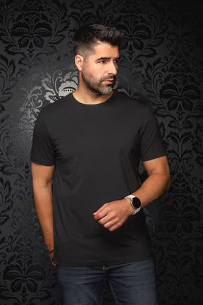 Men's black Short-sleeve T-Shirt on model, front view with crewneck and straight silhouette by Au Noir