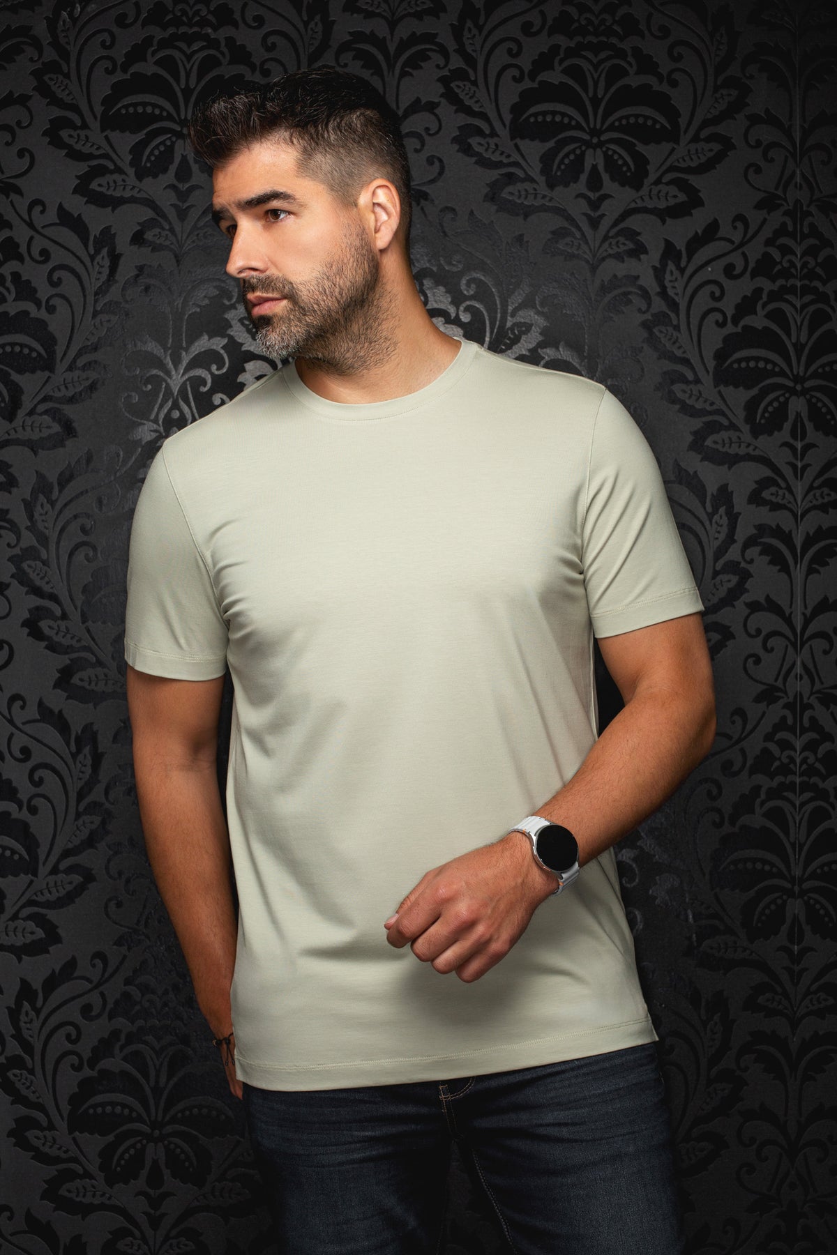 Men's pale sage green short sleeve crewneck T-Shirt on model, front view with straight hem by Au Noir