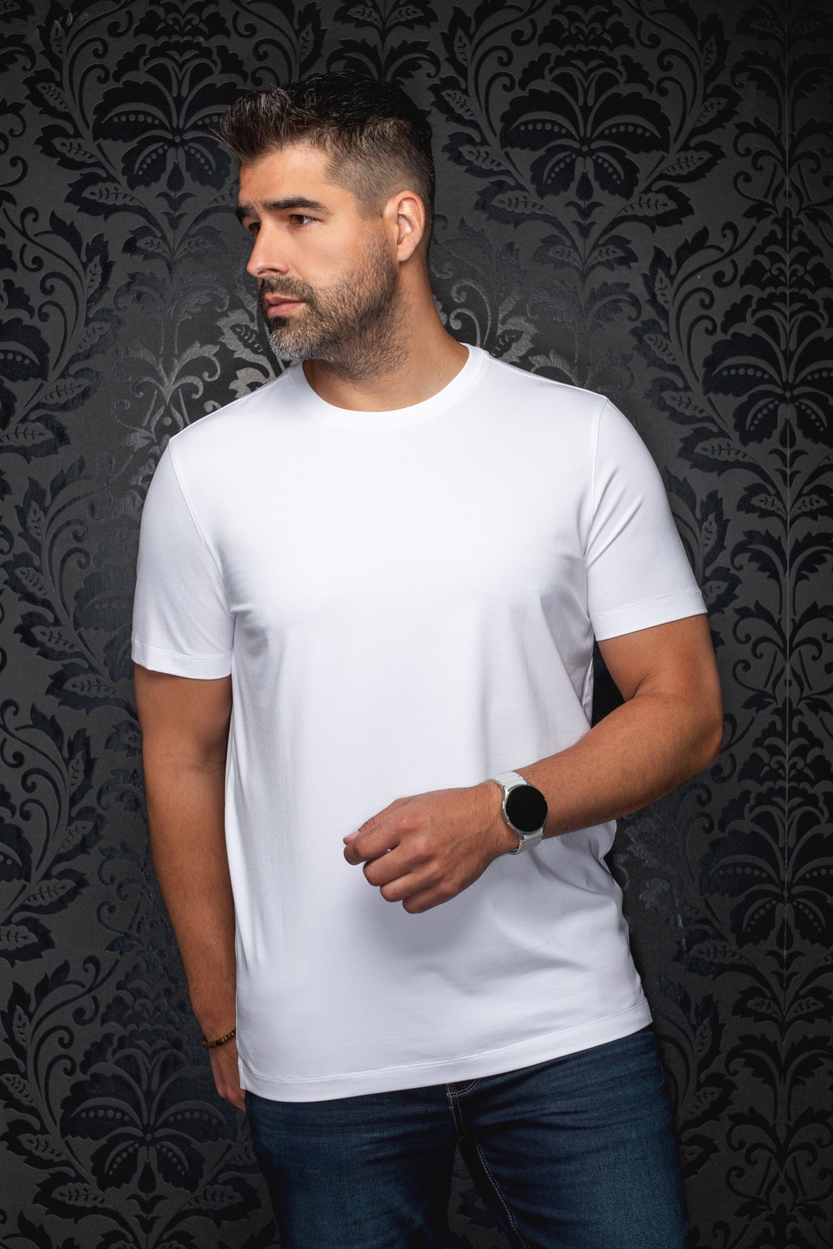 Front view of men's plain white crewneck Short-sleeve T-Shirt worn with jeans by Au Noir