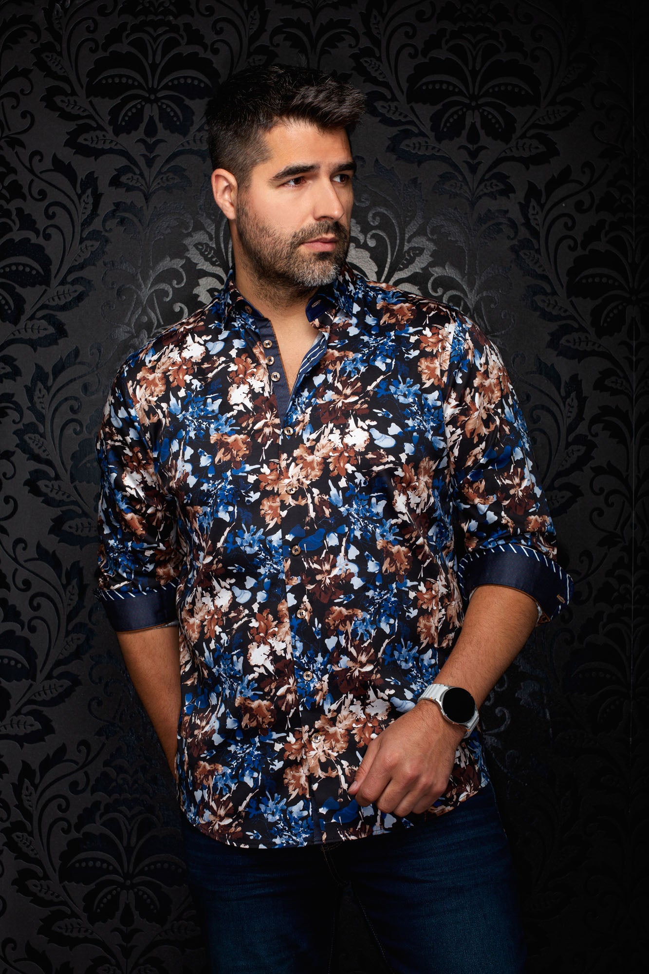 Au Noir men's black floral button-up shirt with blue and brown print and rolled contrast cuffs shown from the front