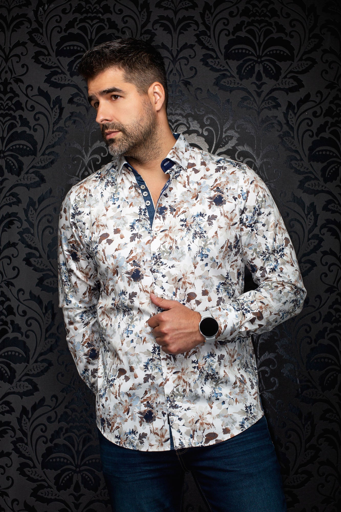 Men's white floral button-up shirt on model, angled front view with navy contrast collar detail by Au Noir