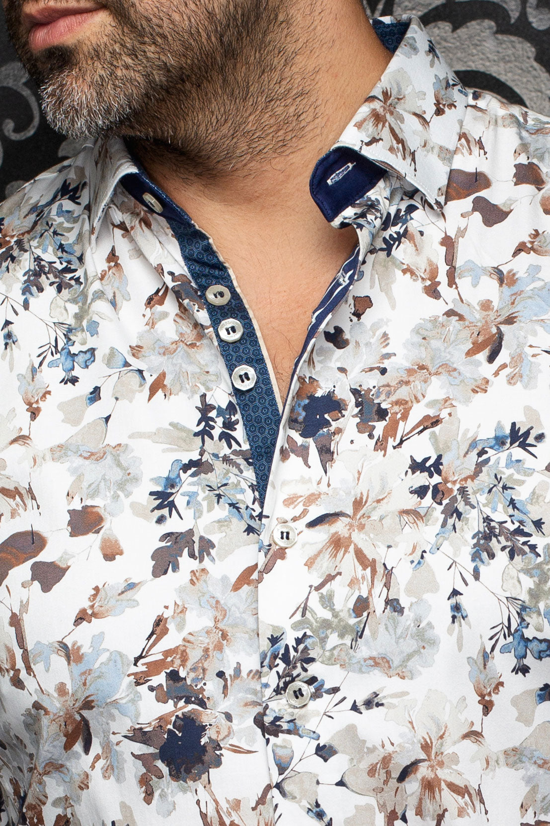Au Noir men's white floral shirt collar, navy inner placket, and white buttons, close-up