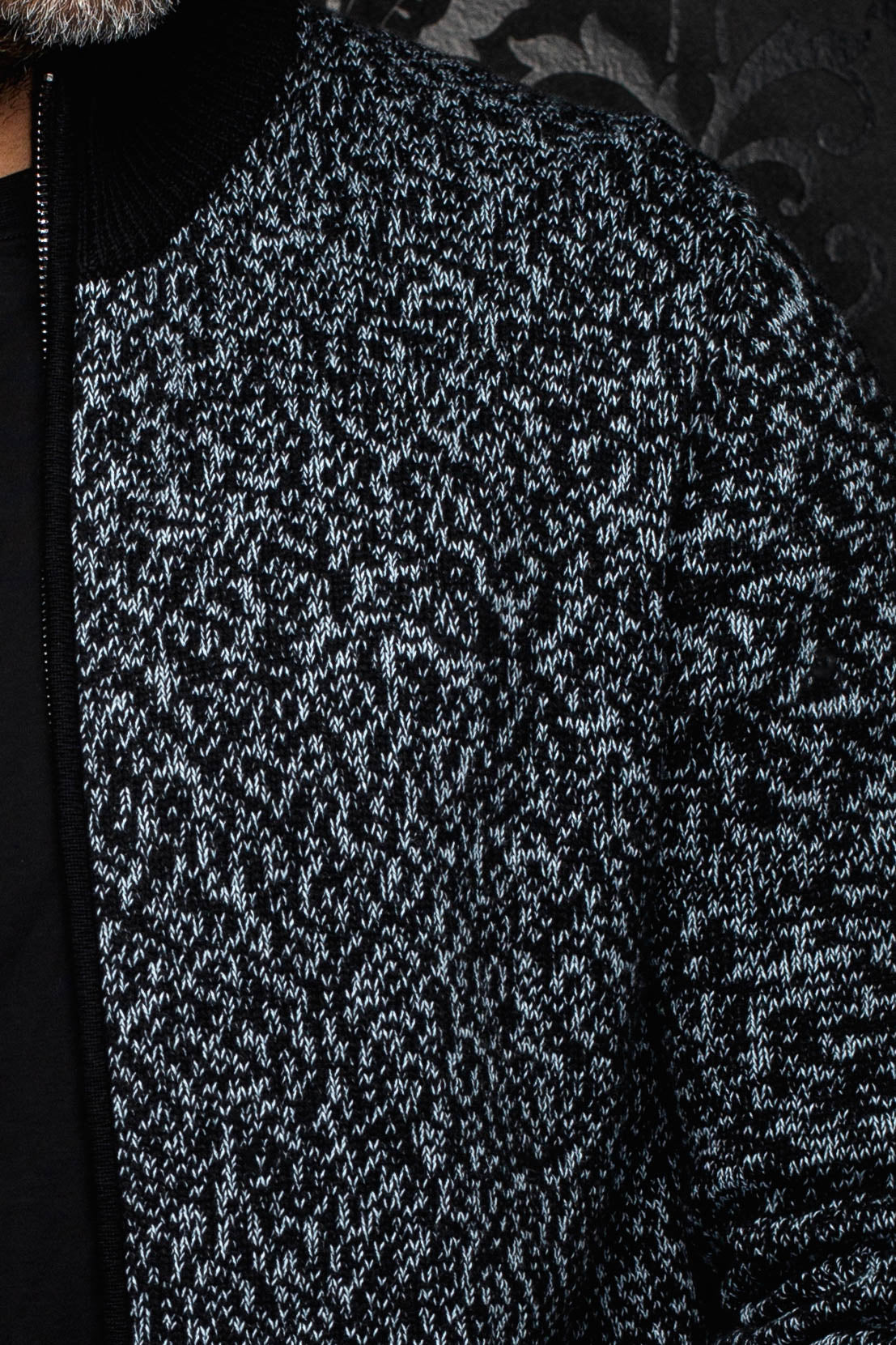 Au Noir men's black and light gray marled knit cashmere jacket sleeve and chest texture, close-up