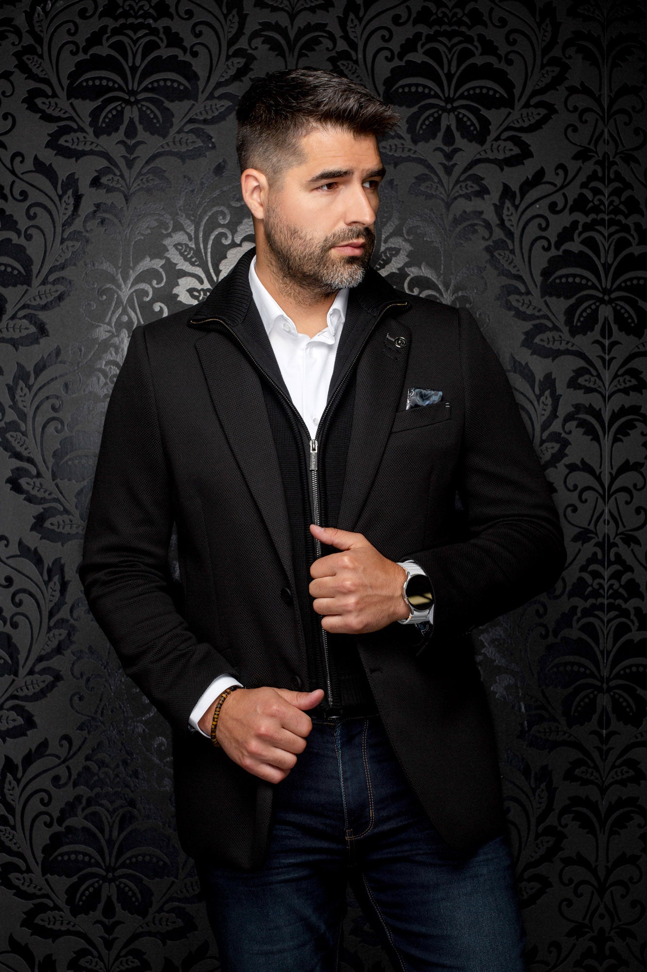 Men's black textured blazer with zip-front knit insert, wider front model view by Au Noir