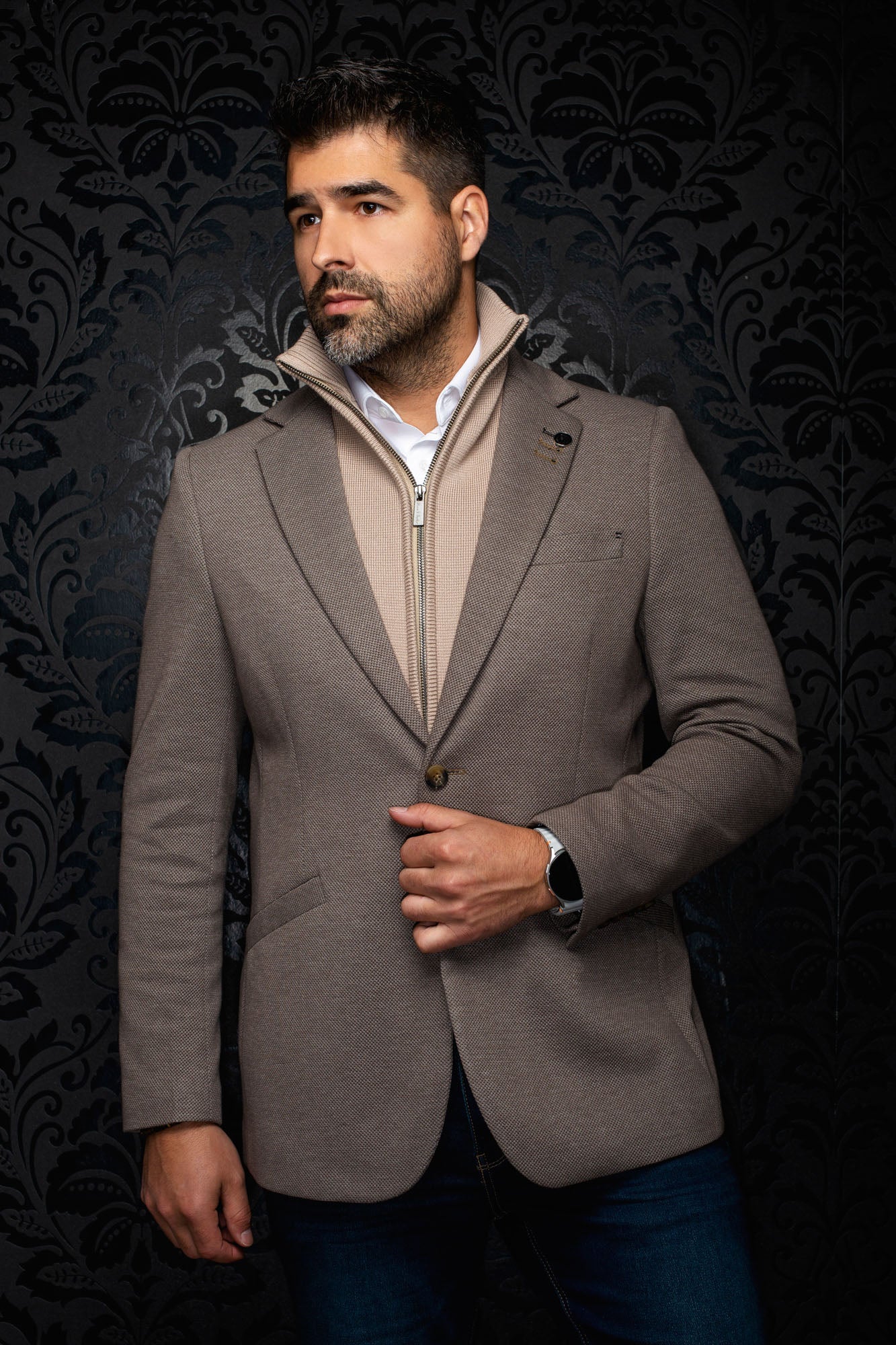 Front view of men's taupe textured blazer with notch lapels, front button and small lapel pin by Au Noir