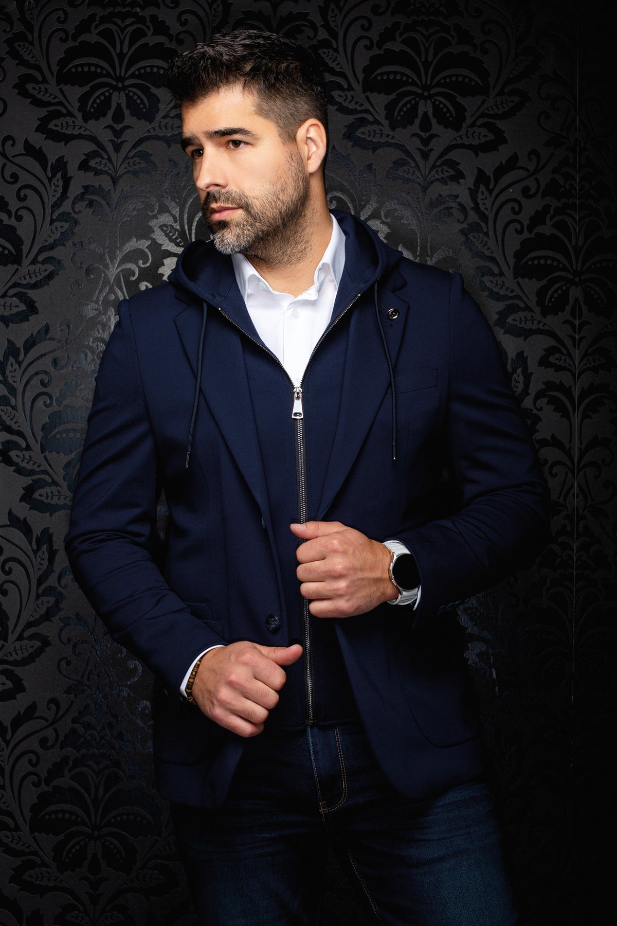 Au Noir men's navy blazer with hooded zip insert, drawstrings, and single button, front model view