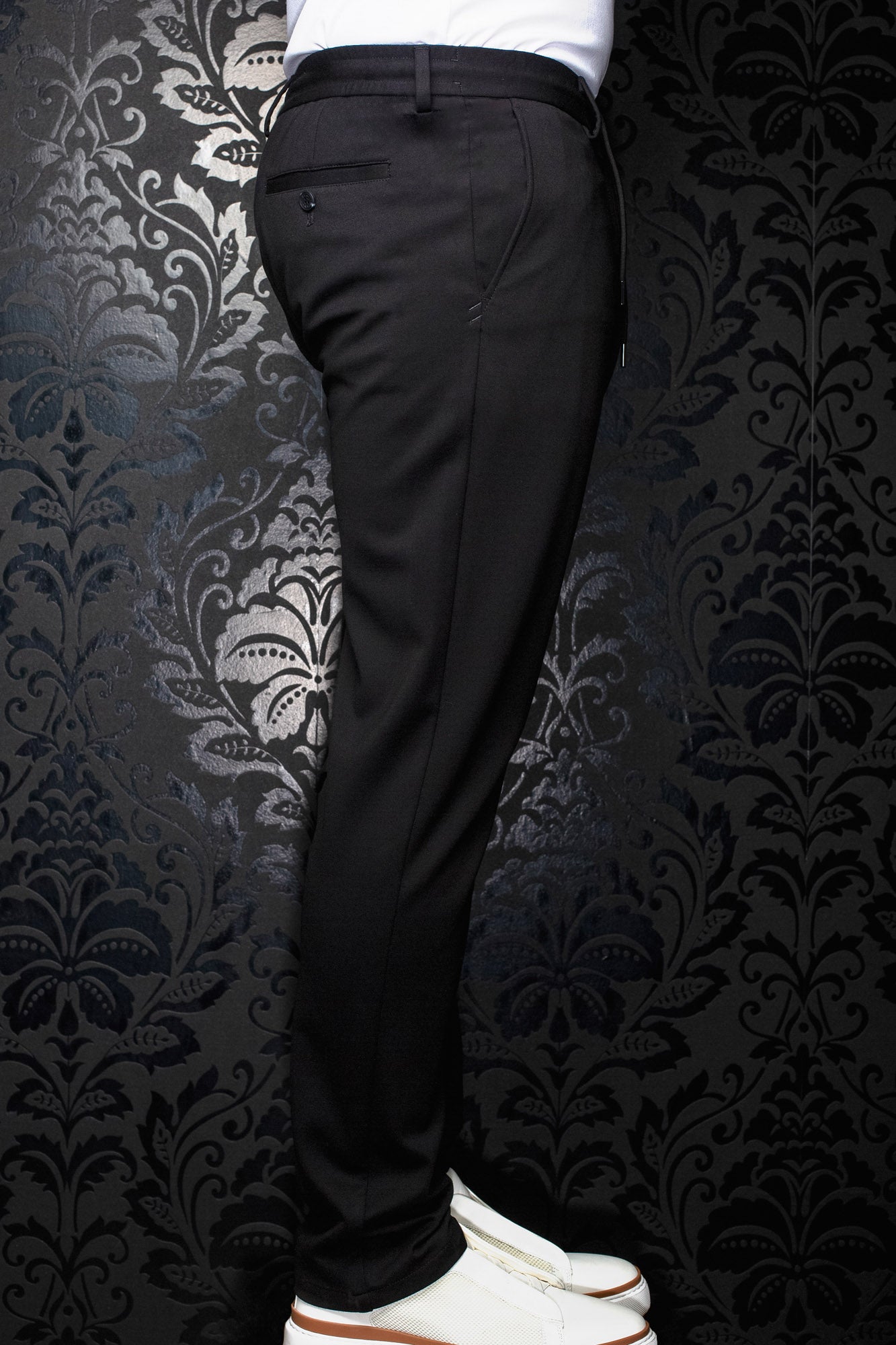 Au Noir men's black pants side view with belt loops, buttoned welt back pocket and tapered leg