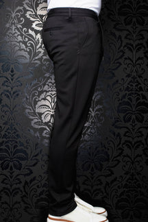 Au Noir men's black pants side view with belt loops, buttoned welt back pocket and tapered leg
