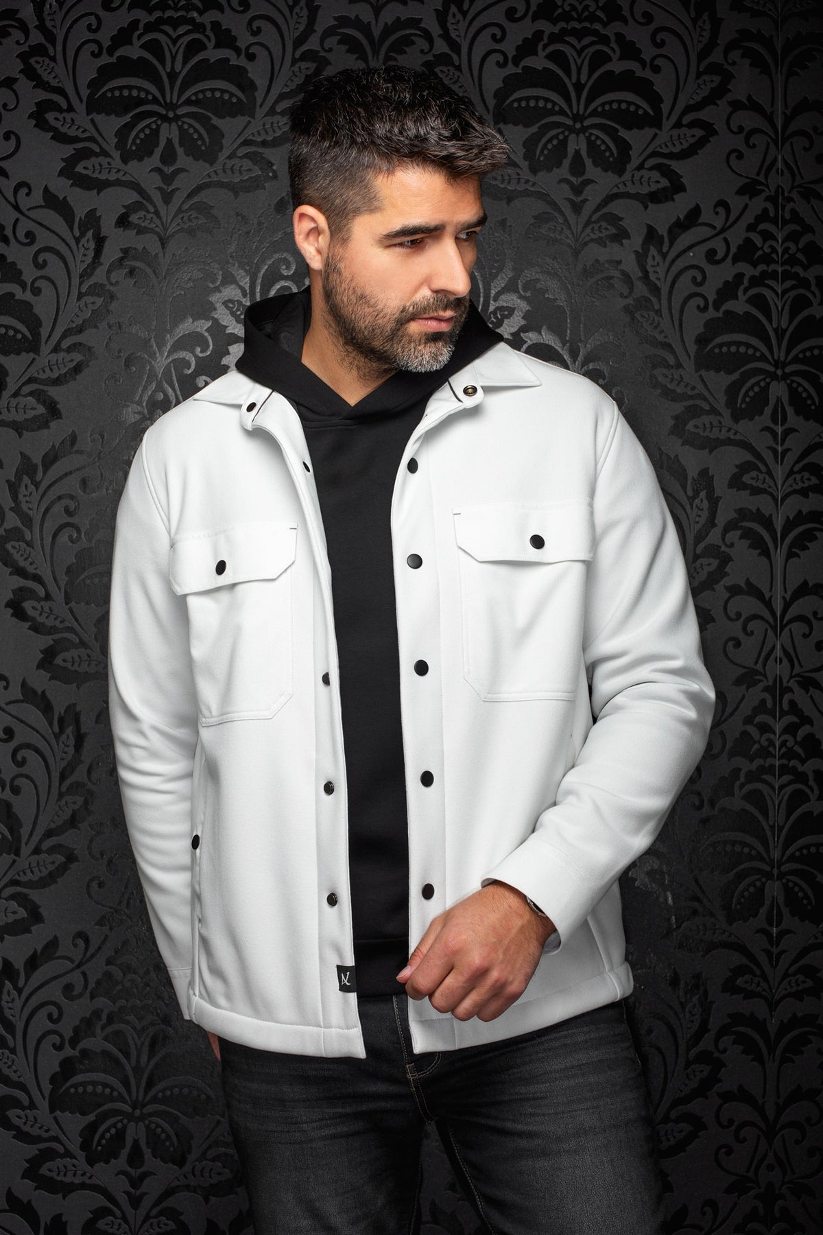 Men's white overshirt front view with black snap buttons and flap chest pockets by Au Noir