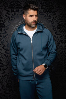 Men's teal full-zip hooded sport jacket on model, front view with drawstrings and split pockets by Au Noir