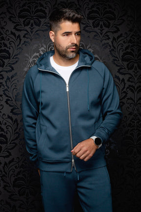 Men's teal full-zip hooded sport jacket on model, front view with drawstrings and split pockets by Au Noir