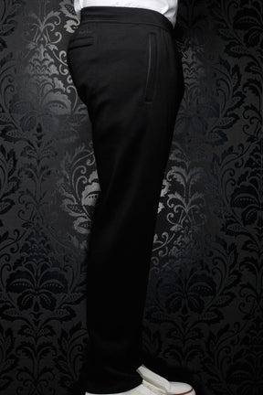 Side view of men's black jogging pants with elastic waistband, drawstring and vertical pocket detail by Au Noir