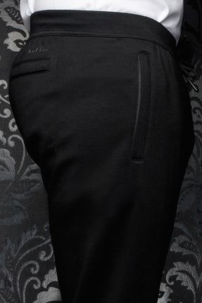 Au Noir men's black jogging pants with wide waistband, back welt pocket and tonal logo, close view
