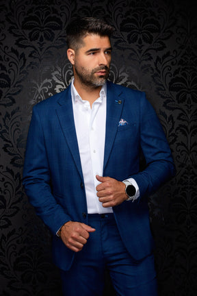 Au Noir men's blue textured blazer with notch lapels, flap pockets, and lapel pin shown from the front