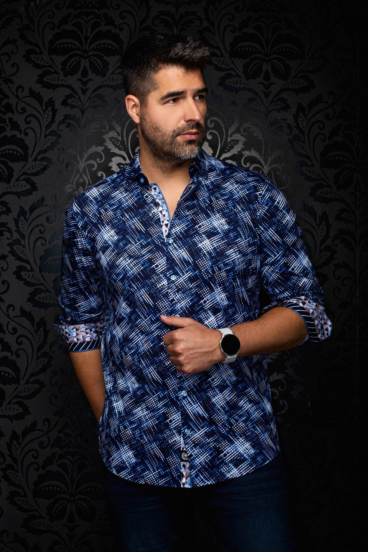 Au Noir men's angled front view of a navy patterned shirt with rolled cuffs and contrast cuff facing