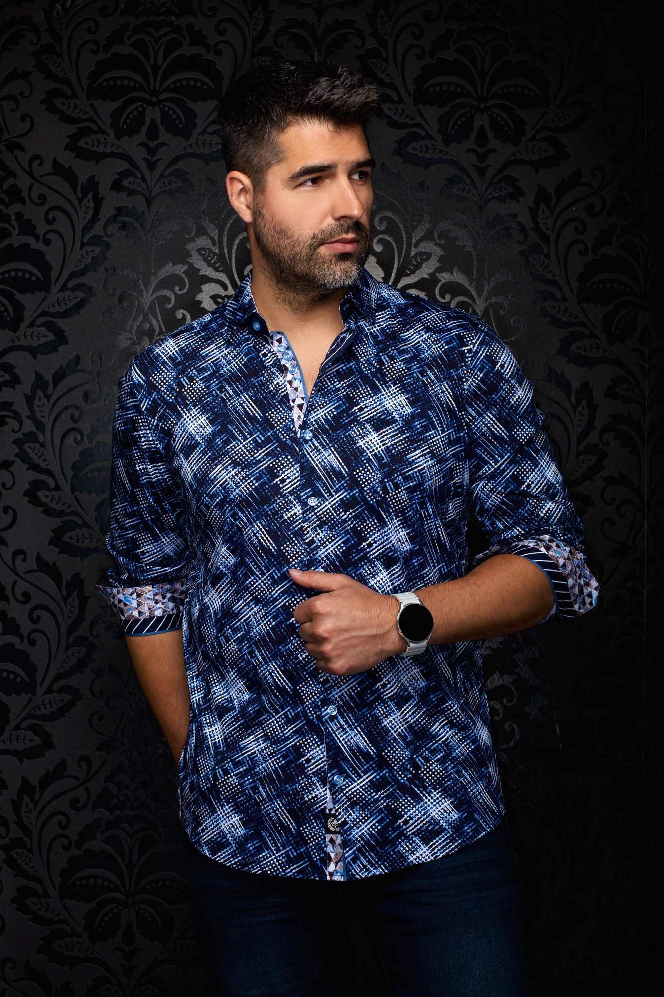 Au Noir men's angled front view of a navy patterned shirt with rolled cuffs and contrast cuff facing