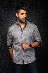 Front model view of men's gray floral button-up shirt with black contrast cuffs and placket by Au Noir