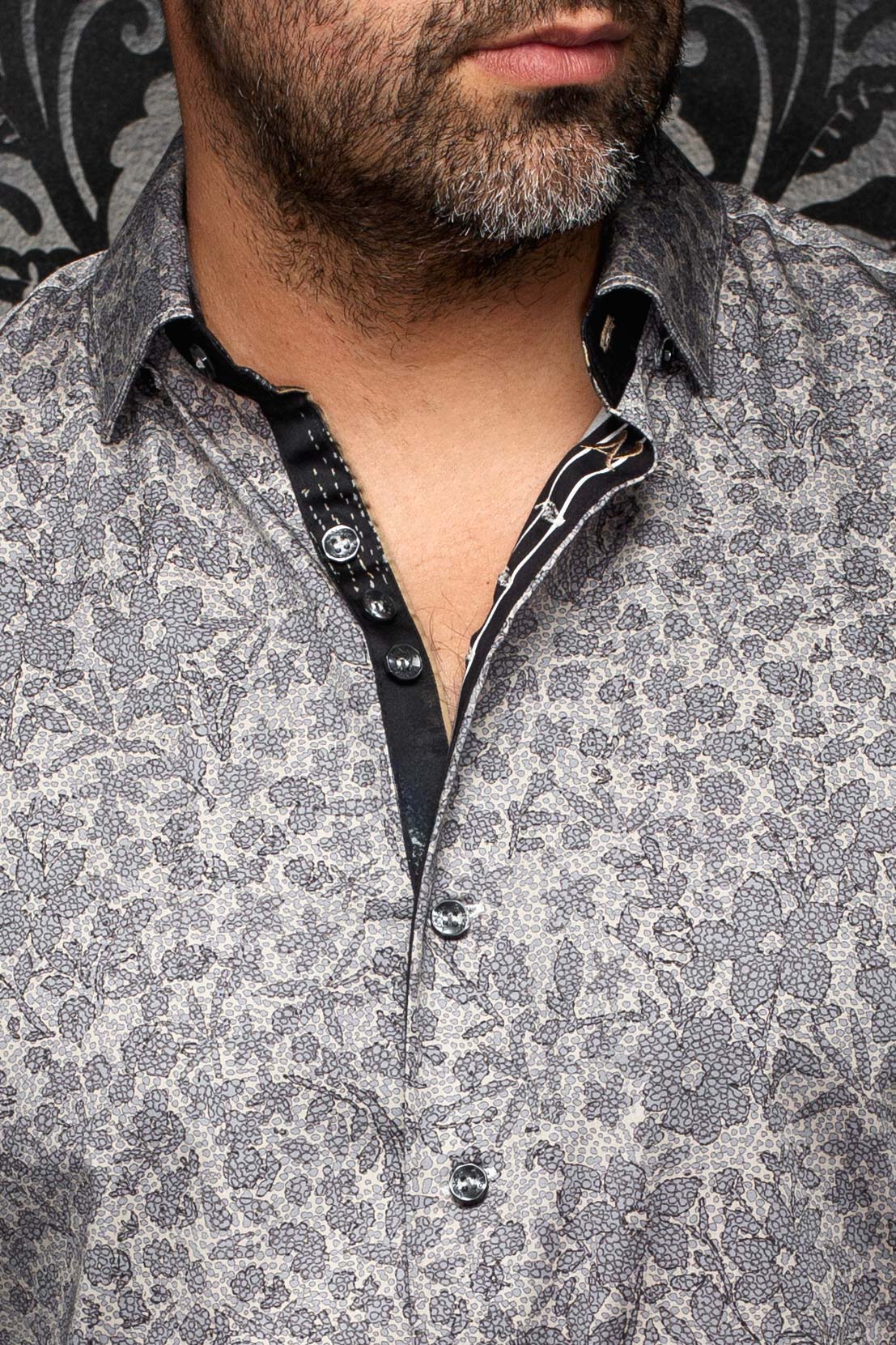 Au Noir men's gray floral button-up shirt with black contrast placket, collar, and shiny buttons, close-up